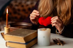 Passion Love Spell – Ignite Deep Love & Desire Instantly 11 Passion Love Spell - a person sewing a heart